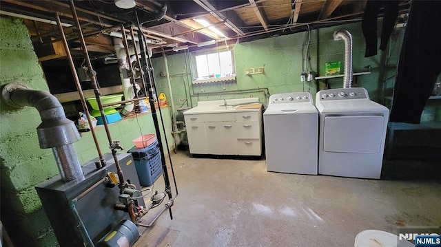 basement with washing machine and clothes dryer