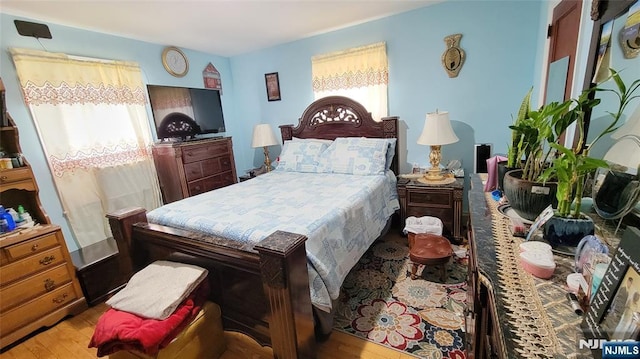 bedroom featuring light wood finished floors