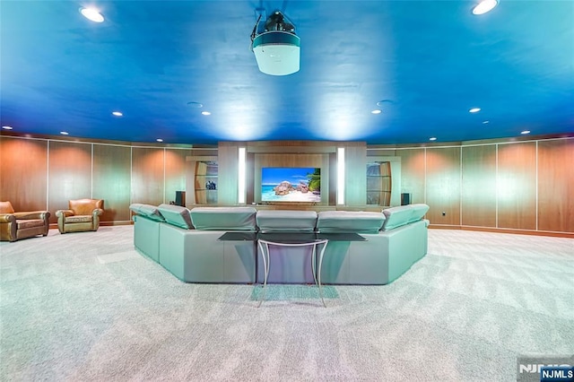 home theater room featuring a decorative wall, recessed lighting, and carpet