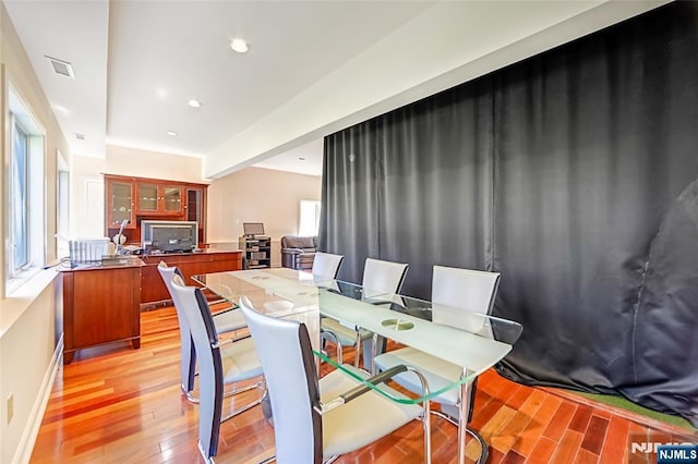 dining area featuring light wood-style flooring, recessed lighting, and visible vents