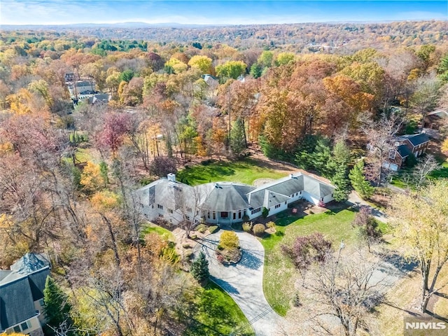 aerial view featuring a forest view