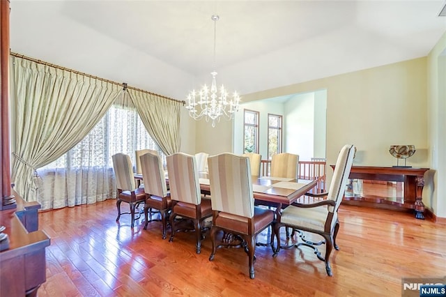 dining area featuring a chandelier and light wood-style flooring