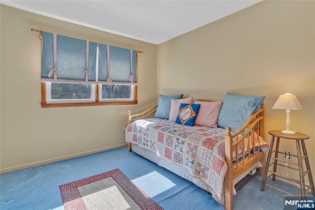 bedroom with carpet and baseboards