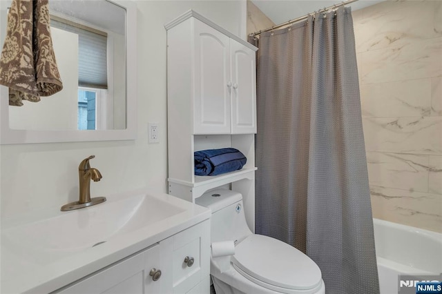 bathroom with shower / bath combination with curtain, vanity, and toilet