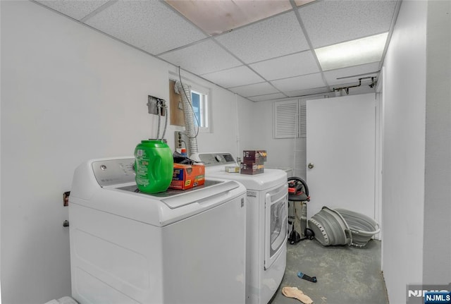 washroom with washer and dryer and laundry area