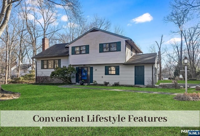 split level home featuring a front lawn and a chimney