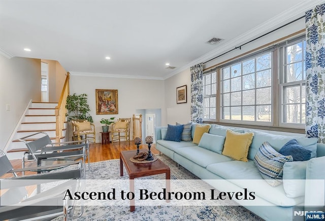 living area with recessed lighting, visible vents, stairway, ornamental molding, and wood finished floors