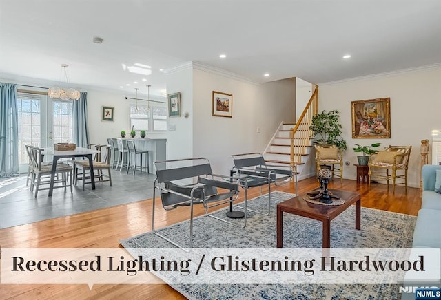 living room with ornamental molding, stairway, wood finished floors, and recessed lighting