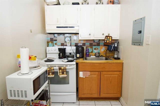 kitchen with white appliances, electric panel, backsplash, under cabinet range hood, and a sink