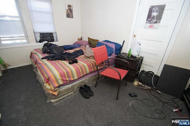 bedroom featuring dark colored carpet