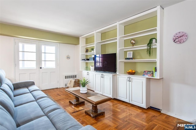 living room featuring radiator heating unit