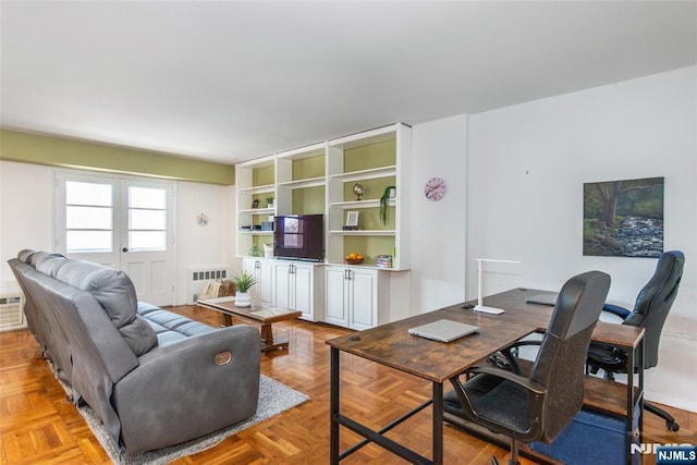 living room featuring french doors and radiator heating unit