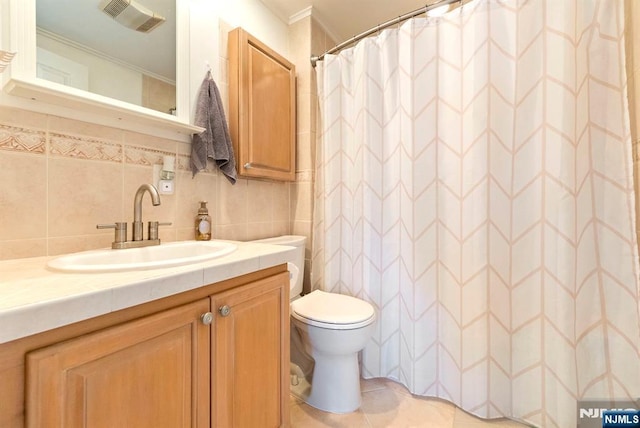 full bathroom with visible vents, toilet, backsplash, tile patterned flooring, and vanity