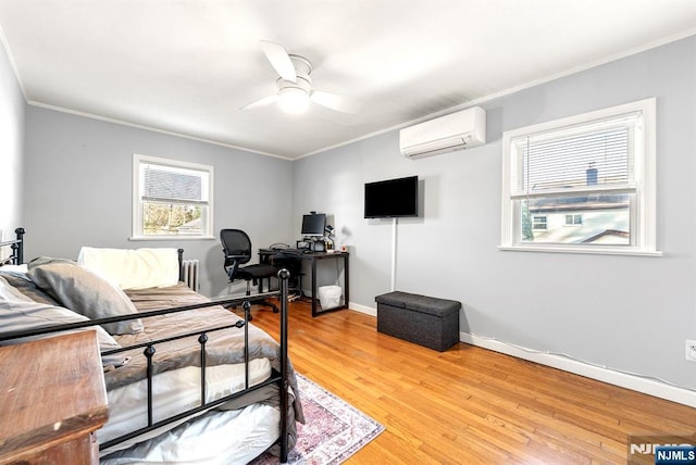 bedroom featuring baseboards, a wall mounted air conditioner, radiator heating unit, ornamental molding, and light wood-style floors