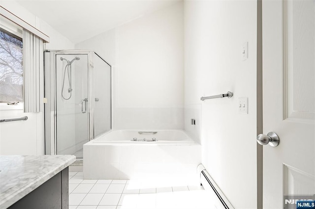 bathroom featuring a stall shower, a baseboard radiator, a bath, and vanity