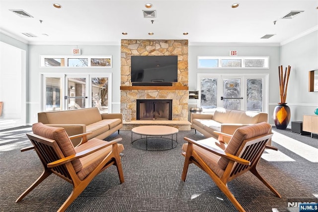 living area featuring ornamental molding, carpet flooring, and visible vents