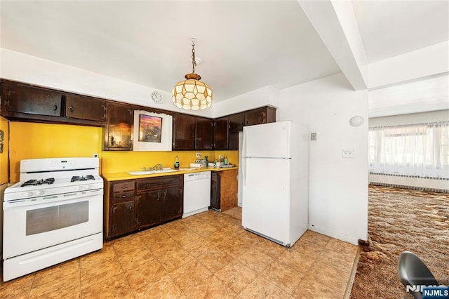 kitchen featuring pendant lighting, radiator, light countertops, a sink, and white appliances