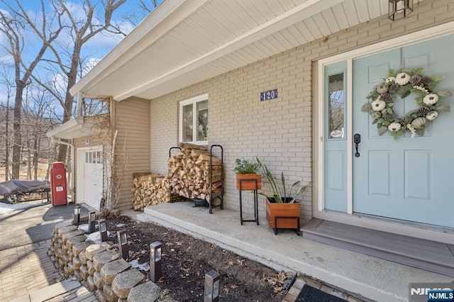 entrance to property with brick siding