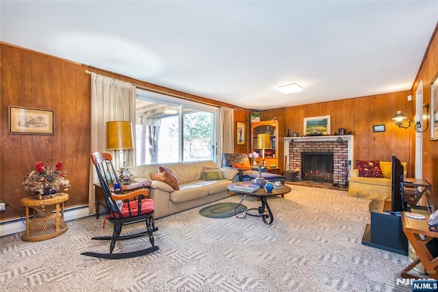 living room featuring carpet, wood walls, and a fireplace