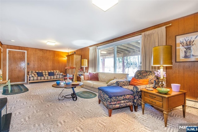 living room with carpet and wood walls