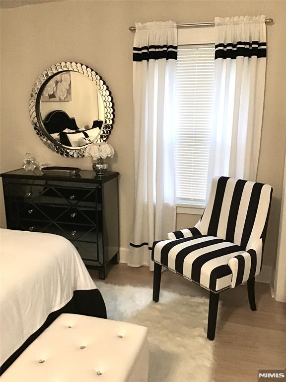 bedroom with wood finished floors