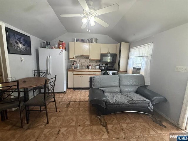 235 Garside Ave, Wayne, NJ 07470 - kitchen featuring freestanding refrigerator, stainless steel range with electric cooktop, black microwave, cream cabinets, and vaulted ceiling