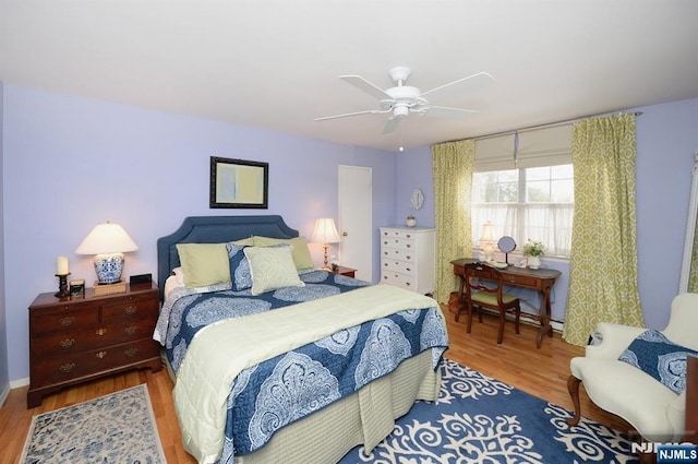 bedroom featuring wood finished floors and a ceiling fan