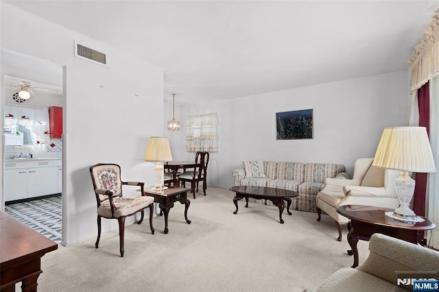 living room with light carpet and visible vents