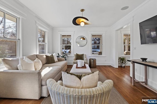 living room with ornamental molding, dark wood-style flooring, and baseboards