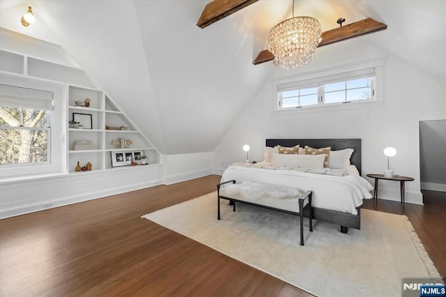 bedroom with lofted ceiling, multiple windows, and dark wood finished floors