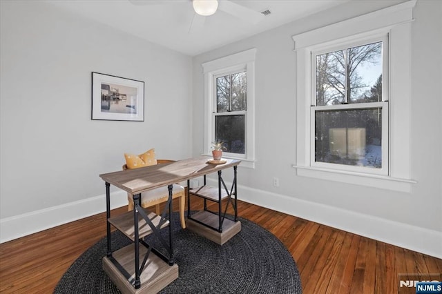 office area featuring a healthy amount of sunlight, baseboards, and wood finished floors