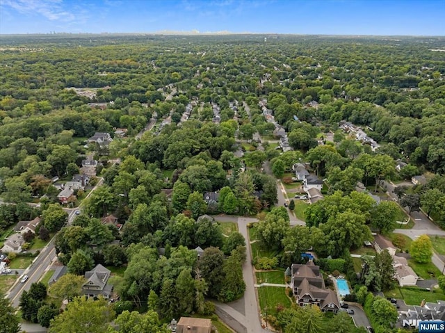 bird's eye view with a forest view and a residential view