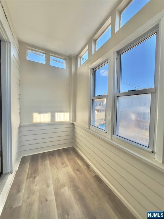 unfurnished sunroom with a healthy amount of sunlight