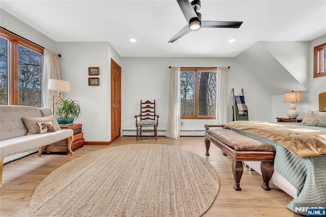 bedroom featuring baseboard heating, recessed lighting, a ceiling fan, and light wood-style floors