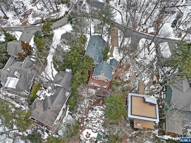 snowy aerial view featuring a residential view