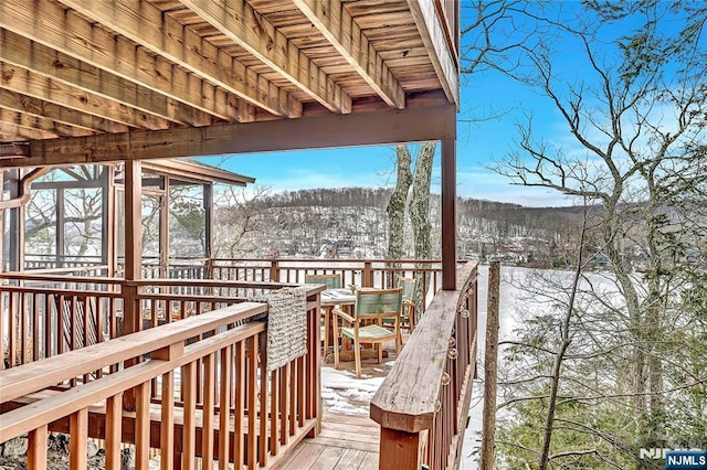 view of snow covered deck