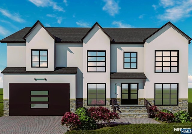 view of front of house featuring stone siding, a garage, decorative driveway, and stucco siding