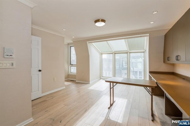 office area with ornamental molding, light wood finished floors, recessed lighting, and baseboards