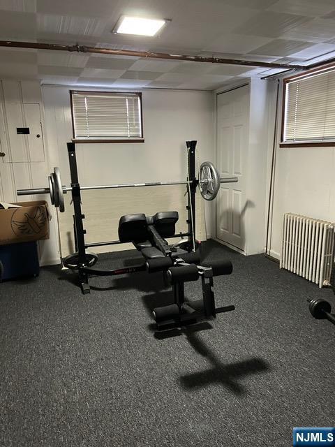 exercise area featuring radiator heating unit