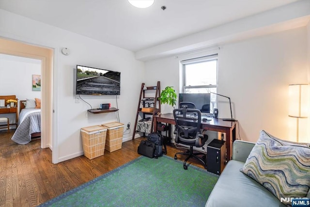 office featuring baseboards and wood finished floors