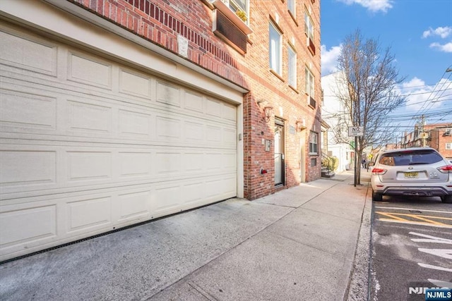 garage featuring driveway