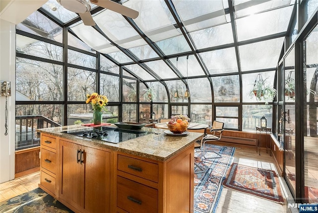 sunroom featuring lofted ceiling