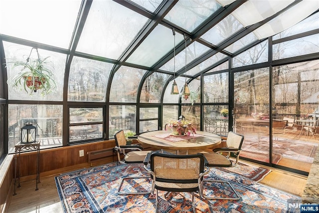 sunroom featuring lofted ceiling