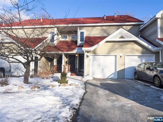 view of front of property featuring driveway and an attached garage