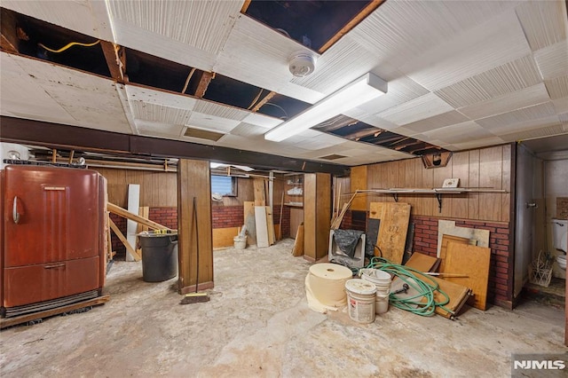 unfinished basement with wood walls