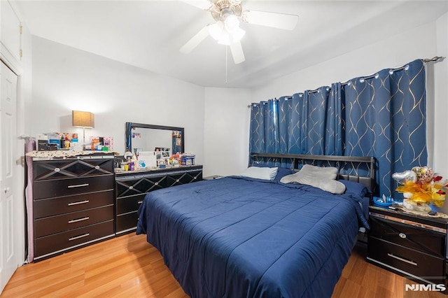 bedroom featuring wood finished floors and a ceiling fan