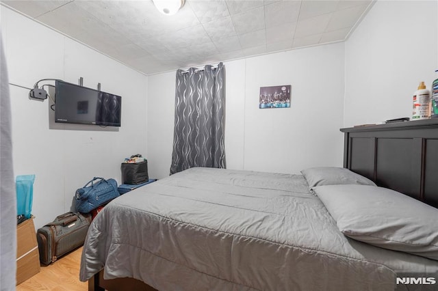 bedroom with wood finished floors