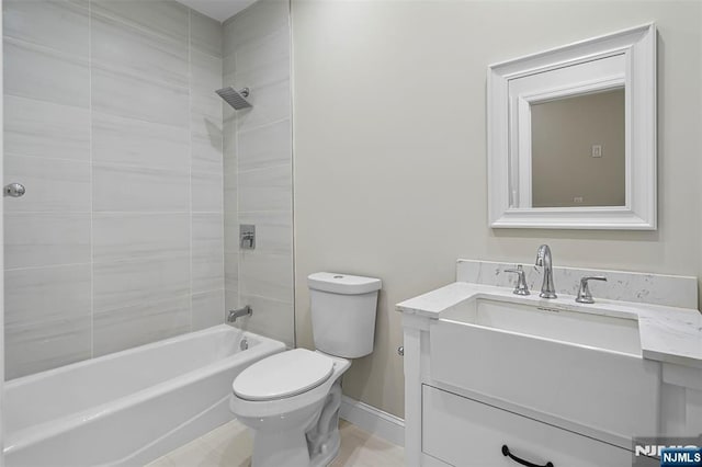 full bath with toilet, shower / bathtub combination, baseboards, and vanity