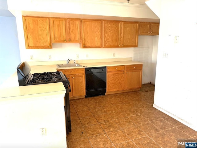 kitchen featuring black dishwasher, light countertops, a sink, and gas stove