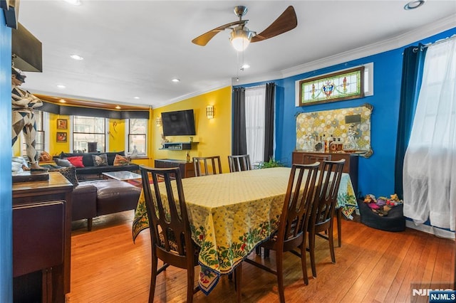 dining area with recessed lighting, ceiling fan, crown molding, and wood finished floors